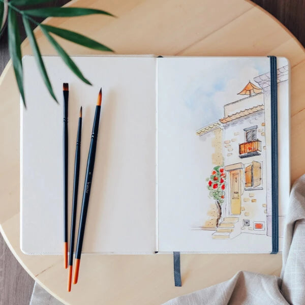 Etchr schetsboek met aquarel kunstwerk