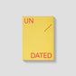 Citroengele mishmash Undated A5 planner met rode 'UN DATED' tekst en een diagonale lijn op een matte kaft.
