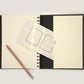 hahnemuhle schetsdagboek a5 met ringband zwart open laatste pagina met vakje en label naamstickers en potlood